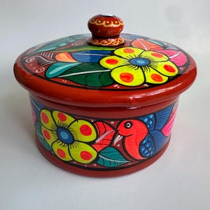 May include: A set of three ceramic mugs with a speckled, matte finish. The mugs are in shades of cream, light gray, and dark gray. Each mug has a simple, minimalist design, perfect for coffee or tea.