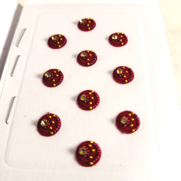 10 Pack Maroon Round Bindis. Full Rhinestone Crystal Bindis in Gold Beads crystals.