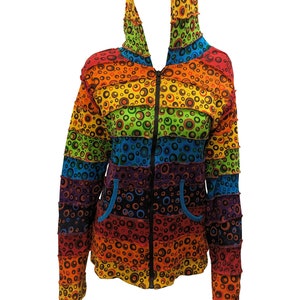 May include: A rainbow striped hooded jacket with a zipper closure and a circle pattern. The jacket has two pockets on the front.