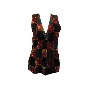 May include: A sleeveless vest with a patchwork design. The vest is made of velvet and features a variety of colours, including black, red, green, and gold.