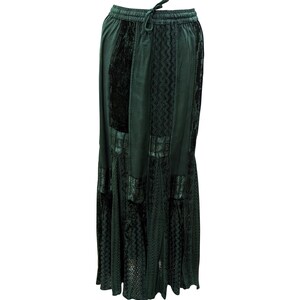May include: A long, dark green skirt with a lace overlay and a drawstring waist.