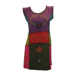 May include: A colourful patchwork dress with a heart-shaped design and floral embroidery. The dress is made of cotton and has a relaxed fit.