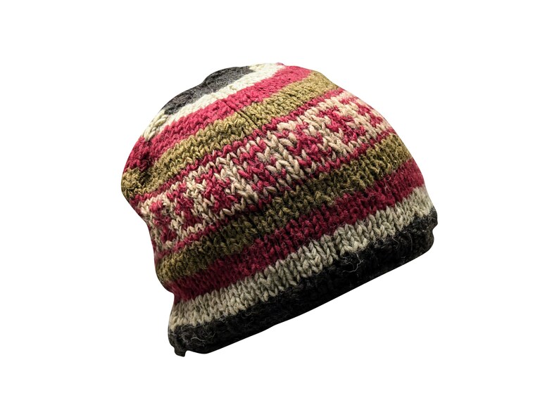 May include: A striped knit beanie hat with red, green, and white stripes. The hat is made of wool and has a slouchy fit.