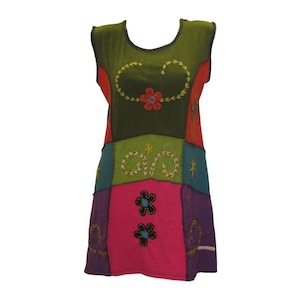May include: A sleeveless patchwork dress with a colourful floral design. The dress is made of different fabrics and has a relaxed fit.