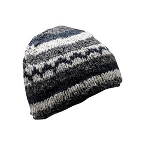 May include: A black and white striped knitted beanie hat.