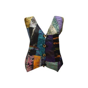 May include: A multi-coloured patchwork vest with a V-neck and button closure. The vest is made of different fabrics and patterns, including floral, geometric, and paisley.