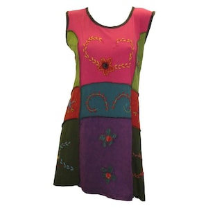 May include: A sleeveless patchwork dress with a pink, green, blue, and purple colour scheme. The dress features embroidered floral and vine designs.