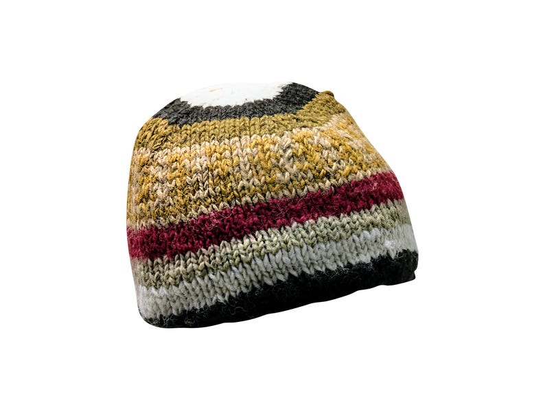 May include: A striped knit beanie hat in shades of brown, white, red, and black.