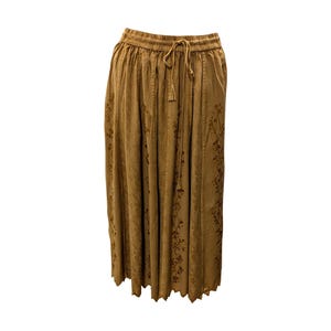May include: A brown midi skirt with a floral print and a drawstring waist.