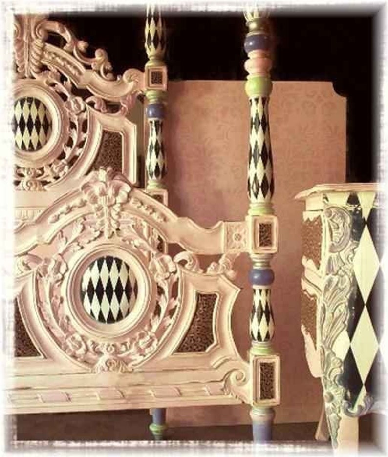 May include: Ornate, cream-colored bed frame with decorative carvings and a harlequin pattern. The bed posts are painted with black and white diamond shapes, accented with green, purple, and gold details. The headboard features a circular design with a black and white diamond pattern.