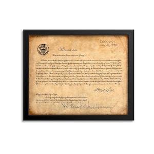 May include: A vintage-style document with the text "The United States" and "July 31, 1790" printed on it. The document is framed in a black frame.