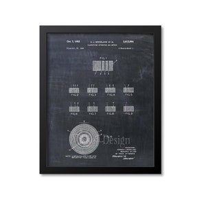May include: A black and white vintage patent drawing on a chalkboard background. The patent is for a classifying apparatus and method. The patent number is 2,612,994 and the date is October 7, 1952. The inventors are Norman J. Woodland and Bernard Silver. The drawing shows a series of diagrams and a circular design.