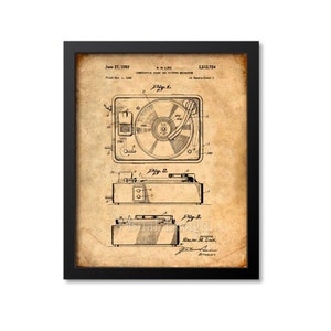 May include: A vintage black and white patent drawing of a record player. The drawing shows three different views of the record player. The patent number is 2,512,724 and the date is June 27, 1950. The inventor is Ralph M. Like.