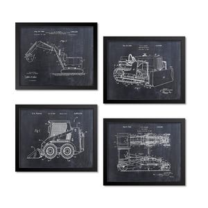 May include: Four framed prints featuring detailed white line drawings of construction equipment on a dark chalkboard background. The prints include an excavator, bulldozer, skid steer, and a machine with a long arm.