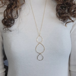 Circle Necklace. This long gold necklace is 14 K Gold Filled. A simple gold necklace with hammered rain drop circles.