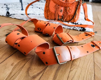 Adjustable cowhide leather shoulder strap. Smooth orange leather