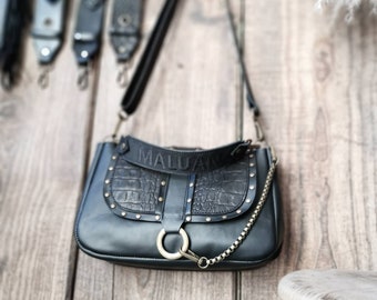 "LOU" handbag in smooth black leather and croco calfskin. Flap with rivets