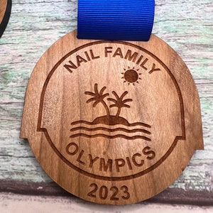 Custom Designed .  Laser Engraved .  Wood Medal .  Hand Finished .