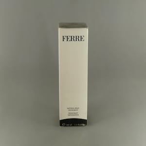 May include: A white rectangular box of Ferre deodorant. The box has the word "FERRE" in black letters at the top. The bottom of the box has the words "NATURAL SPRAY DEODORANT VAPORISATEUR" and the volume is 100 ml.