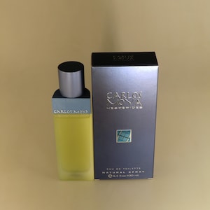 May include: A blue and silver bottle of Carlos Moya Hesperides Eau de Toilette Natural Spray, 3.4 fl oz / 100 ml.