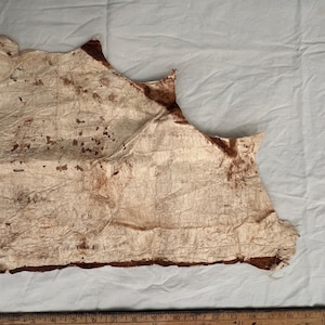 May include: A rustic wooden sign with the text "Welcome to our home" in a handwritten style. The sign is painted white with a distressed finish, and features a small, decorative heart. The sign is designed for indoor or outdoor use.
