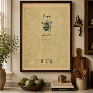 May include: A framed wall art print featuring a light green line drawing of a map of New York's Tavern on the Green in Central Park. The text reads New York's Tavern on the Green in Central Park at West 67th Street, Open the year round, Indoors in winter, Outdoors in summer, and Menu.