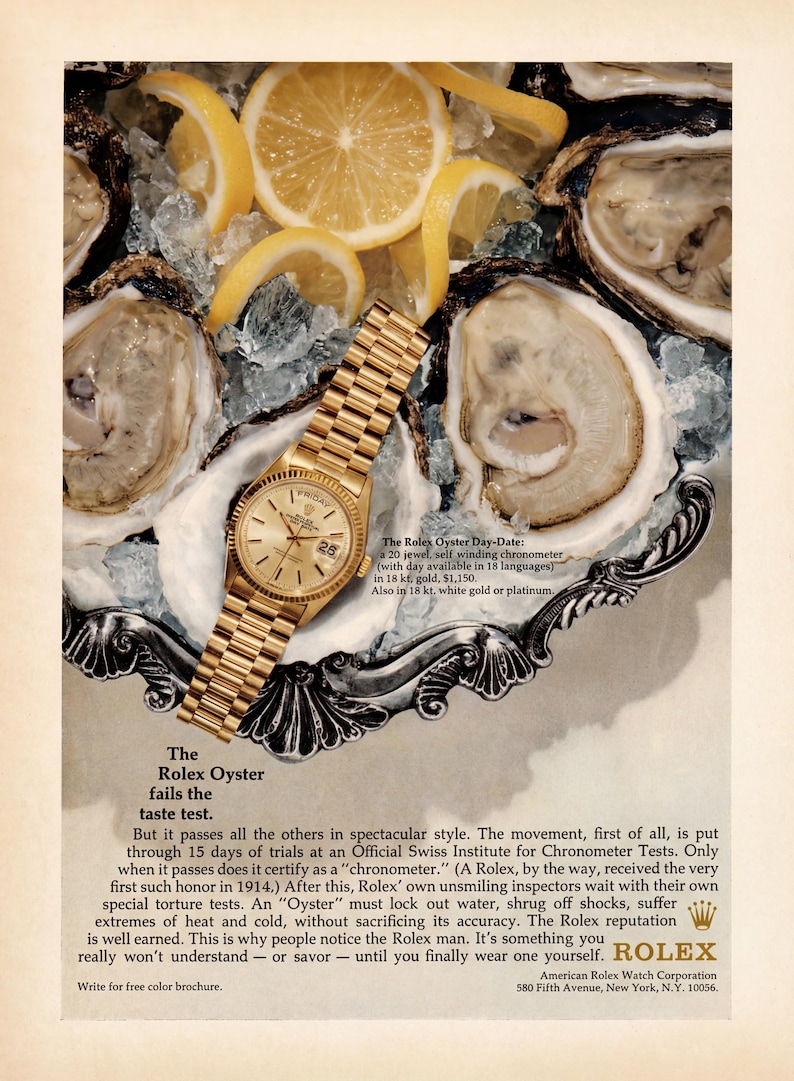 May include: A vintage advertisement featuring a gold Rolex Oyster Day-Date watch with a metallic link band resting on a silver platter filled with crushed ice and fresh lemon slices, surrounded by several raw oysters in their shells.