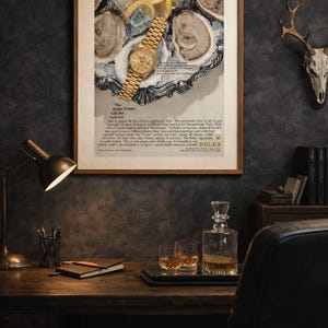 May include: A framed vintage advertisement for a Rolex Oyster watch, featuring a gold wristwatch on a platter with oysters and lemon slices. The ad includes text. A desk with a lamp, notebook, and liquor glasses is in the foreground.