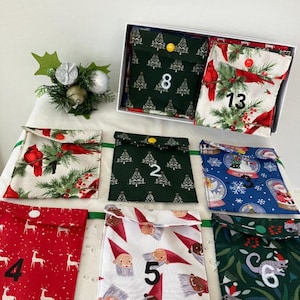 Calendario de adviento reutilizable, estilo bolsillo, de algodón.