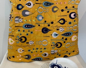 Burnt butter horizontal- A  unique bed or knee quilt that folds into a cushion/pillow. Adult and children's designs.  Can be personalised