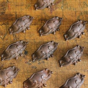 May include: A rustic wooden sign with the text "Welcome to our home" in white lettering. The sign features a distressed finish and a simple, inviting design, perfect for entryway decor.