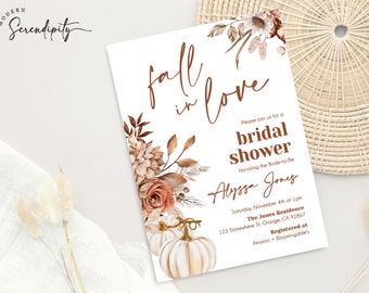 May include: Fall-themed bridal shower invitation with a watercolor illustration of pumpkins, flowers, and leaves. The text reads "fall in love" and "Please join us for a bridal shower Honoring the Bride-to-Be Alyssa Jones Saturday, November 4th at 1pm The Jones Residence 123 Somewhere St. Orange, CA 92867 Registered at Amazon + Bloomingdale's"