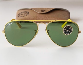 Raras gafas de sol B&L RAY BAN con colores vibrantes en amarillo