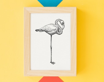 May include: A framed black and white illustration of a flamingo standing on one leg. The artwork is in a light wood frame, set against a vibrant yellow, blue, and red background. The flamingo is detailed with shading, showcasing its curved neck and long legs.