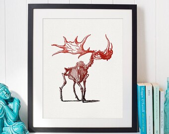 May include: Framed art print featuring a red illustration of a moose skeleton on a white background. The artwork is displayed in a black frame and is part of a home decor collection. The print is a unique piece of wall art.