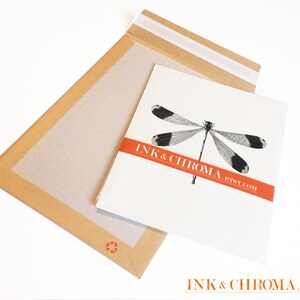 May include: A white envelope with a black and white dragonfly illustration and the text "INK & CHROMA. ETSY.COM" in red.