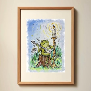 May include: A watercolor painting of a green frog playing a banjo on a tree stump. The frog is sitting under a candle on a candlestick. The background is a blue sky with white clouds.