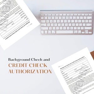 May include: A black and white document with the text "Background Check and Credit Check Authorization". The document is on a white surface with a silver keyboard.