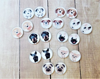 May include: A collection of 18 round glass cabochons with various dog breeds printed on them. The cabochons are white with black outlines and feature different dog breeds, including a pug, a dachshund, a chihuahua, a dalmatian, and a golden retriever.