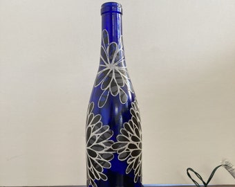 Handcrafted Night light with Blue and white flowers on a blue bottle