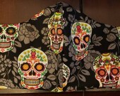 Medium cotton fabric facemask with sugar skulls.