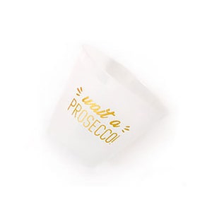 May include: White plastic cup with gold lettering that says "wait a prosecco!"