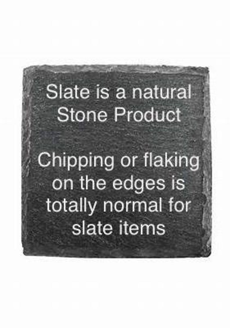 May include: A black slate sign with white text that reads "Slate is a natural Stone Product. Chipping or flaking on the edges is totally normal for slate items."