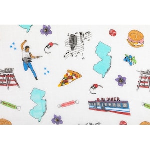 May include: A white background with a repeating pattern of New Jersey themed illustrations.  The illustrations include a slice of pizza, a diner, a gas pump, a microphone, a guitar player, a lifeguard stand, a candy bar, a blueberry bush, and a flower.
