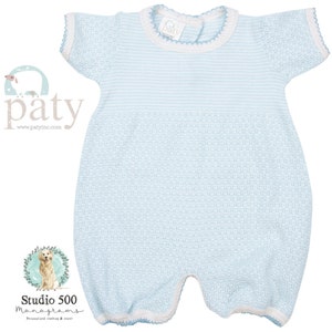 May include: A light blue and white striped baby onesie with short sleeves and a white crocheted trim around the neckline and sleeves. The onesie has a small white tag with the text "Patty" on it.
