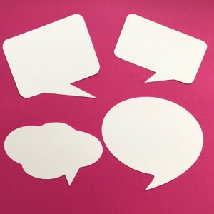 May include: Four white speech bubbles of different shapes on a pink background. The bubbles are blank and ready for text or images.