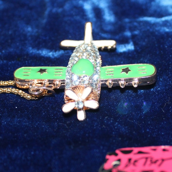 Betsey Johnson Airplane Pendant Necklace.  Propellers Rotate!  Post World War II Design. White & Green Enamel, Rhinestones. NEW w/ Gift Bag!