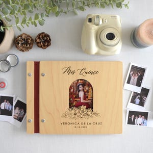 Customizable quinceañera guest book with a photo insert and engraved floral design on the cover. This wooden guest book is perfect for capturing memories and messages from friends and family during the celebration. Fully customizable photo and text.