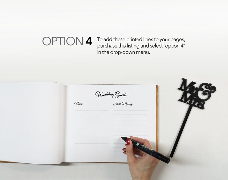 May include: A white wedding guest book with a black pen and a black "Mr & Mrs" topper. The book has lines for guests to write their names and short messages.