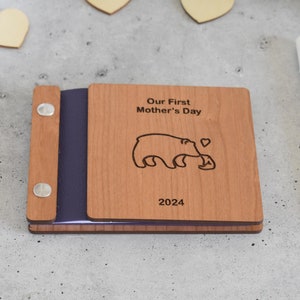 First Mothers Day wooden photo album with charming mama bear design for cherished memories.